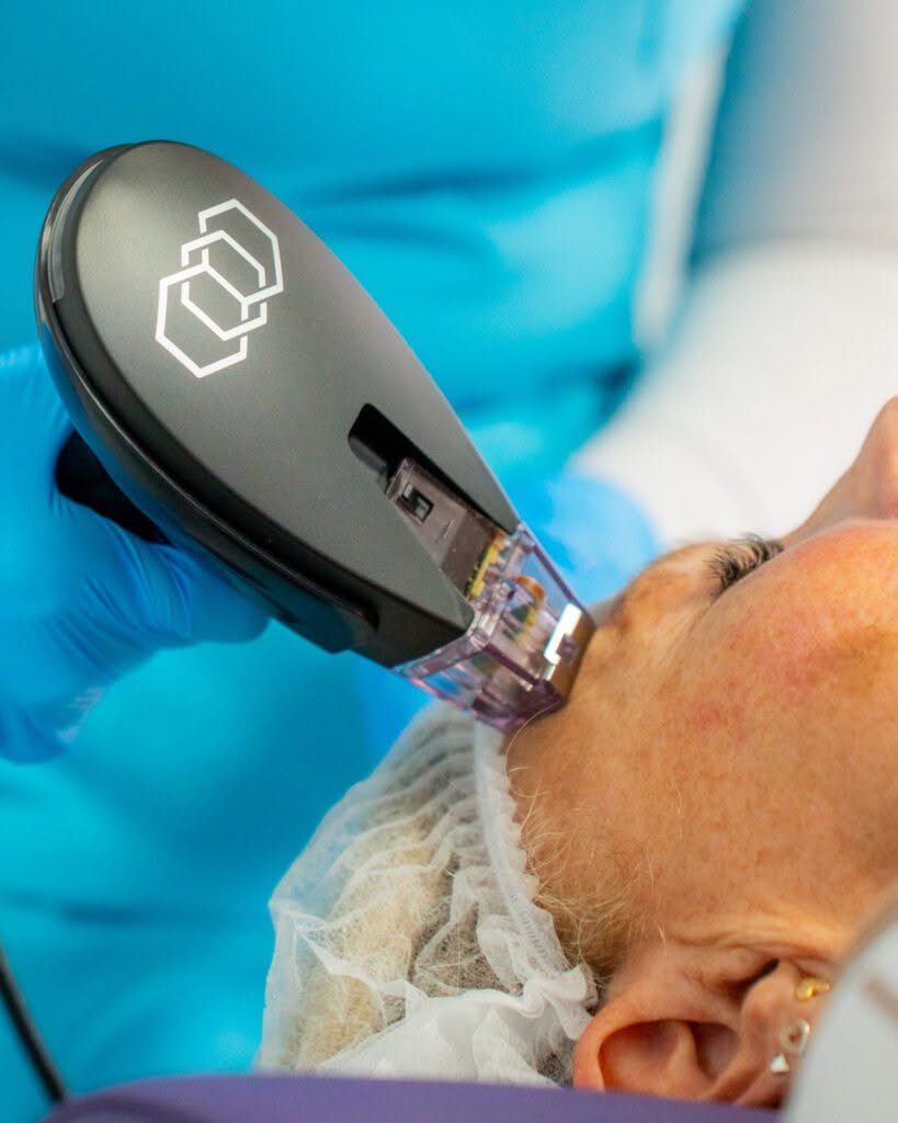 A woman receives a hair treatment with a hair dryer at Ivee Restorative Care salon.